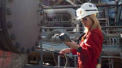 A woman checking the instrument