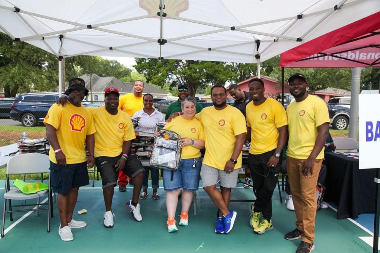 Geismar volunteers donate and hand out school supplies to local 'Back to School Bash' event.