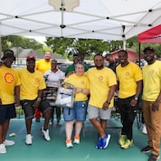 Geismar volunteers donate and hand out school supplies to local 'Back to School Bash' event.