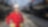 Woman poses in front of rail yard.