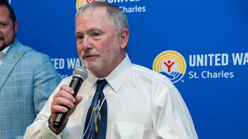 Shell representative Gerry Flood delivers remarks at the United Way of St. Charles Parish Victory Celebration, standing before a United Way St. Charles event backdrop.