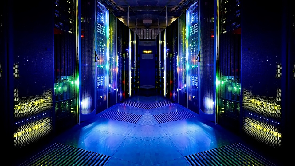Image of data center with LED lights in background
