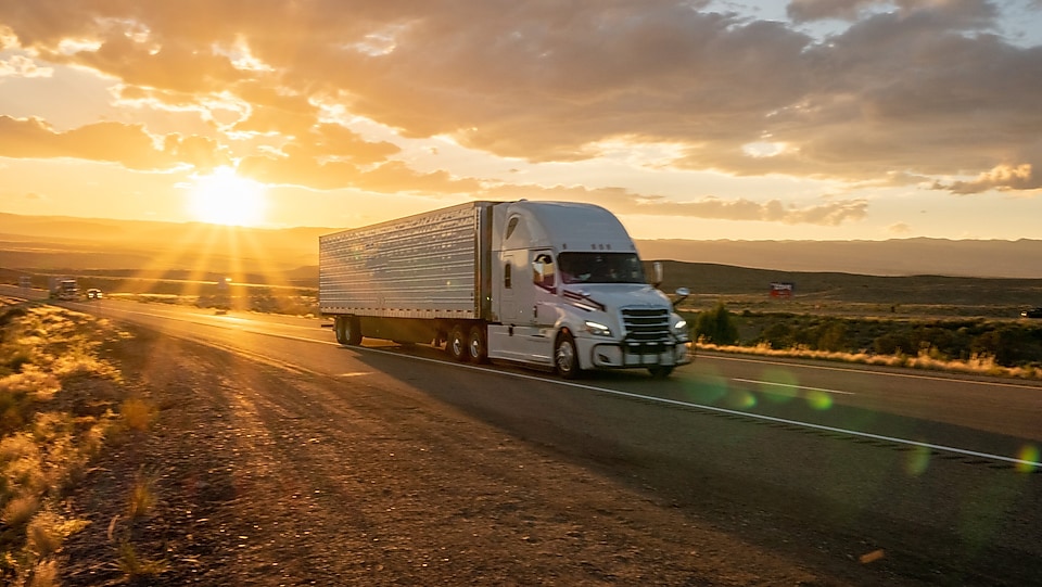 truck travelling during sunset