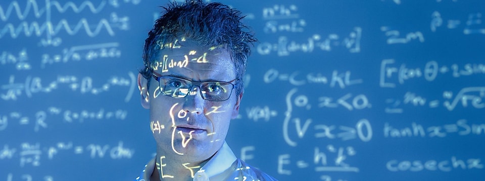  Scientific formulae projected on to face of scientist