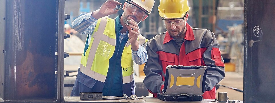 Shell worker consulting an industry worker on site