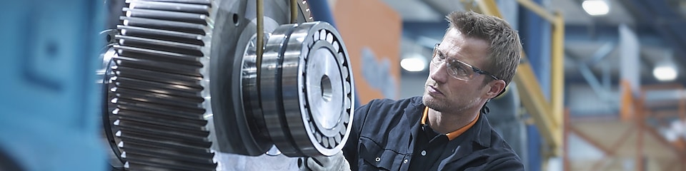 A Shell expert inspects and monitors a piece of machinery