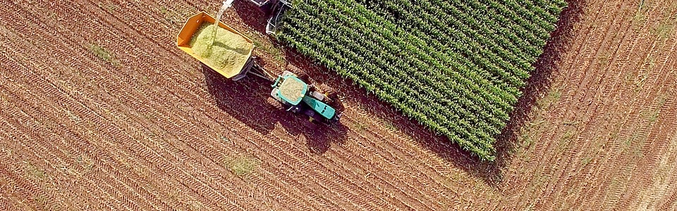 Aerial view of a tractor plowing farmland