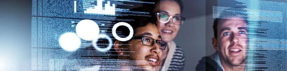 A group of experts analyse code and data on a screen