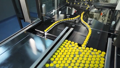 Products being manufactured by automated machinery.