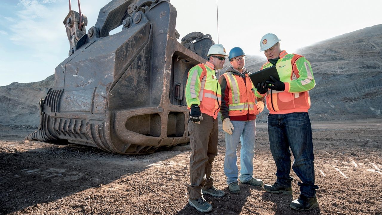 Employees discussing about project on site