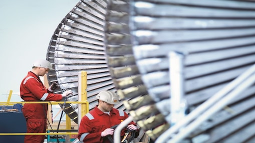 Two engineers working on turbine