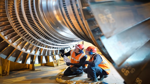 Two technicians’ trouble-shooting a turbine