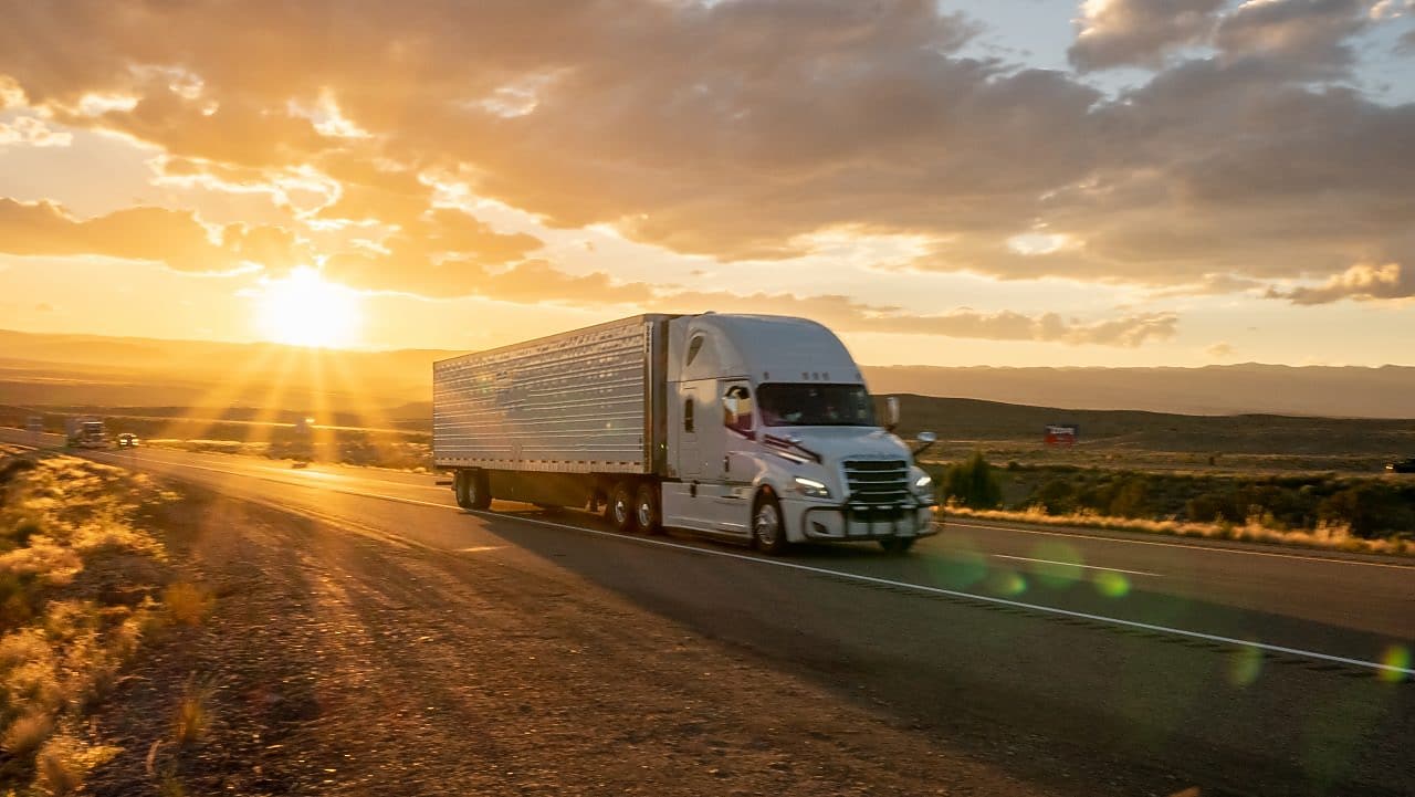 truck travelling during sunset