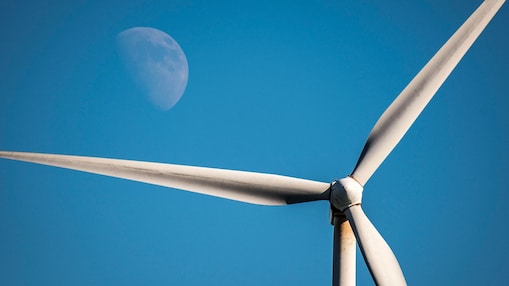 Wind turbine in front of the moon