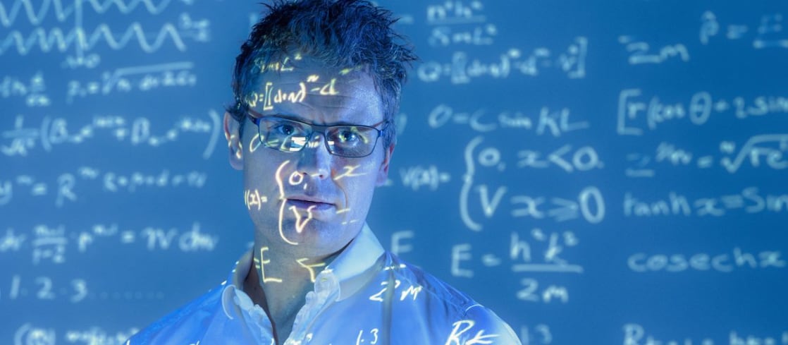 Scientific formulae projected on to face of scientist
