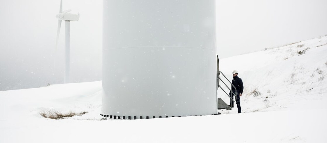 Expert assessing wind turbine