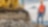 Shell Construction worker standing next to tracked excavator