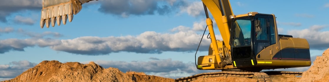 Construction workers and excavator