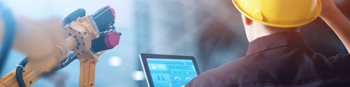 Construction worker using iPad on construction site