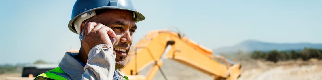 Architect using phone at quarry