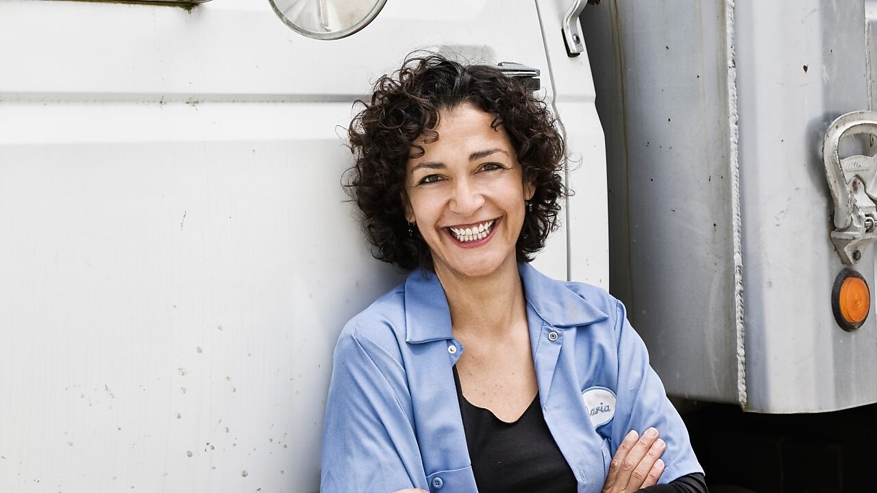 Driver standing outside truck