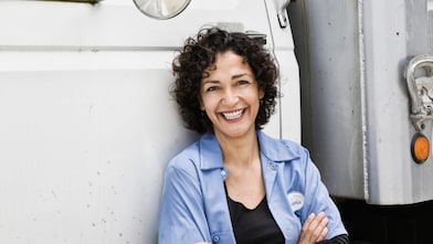Driver standing outside truck