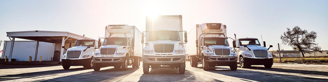 Trucks parked at loading facility