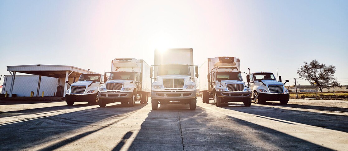 Trucks parked at loading facility