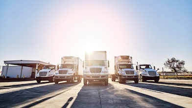 Trucks parked at loading facility