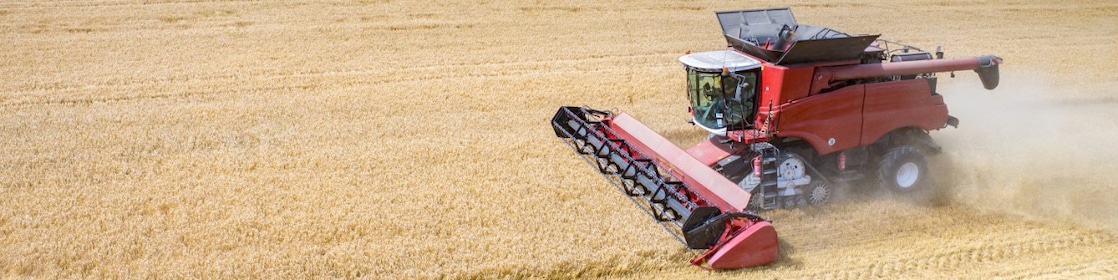 Farming vehicle harvesting crops