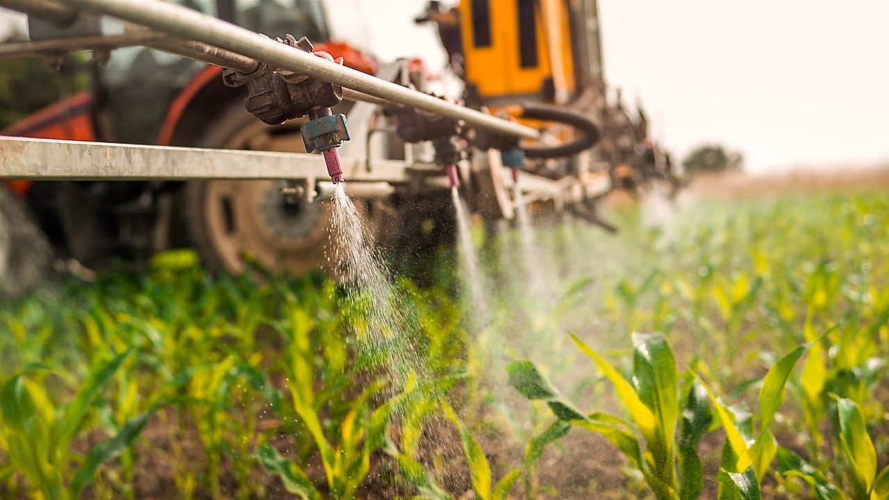 Farming equipment watering crops