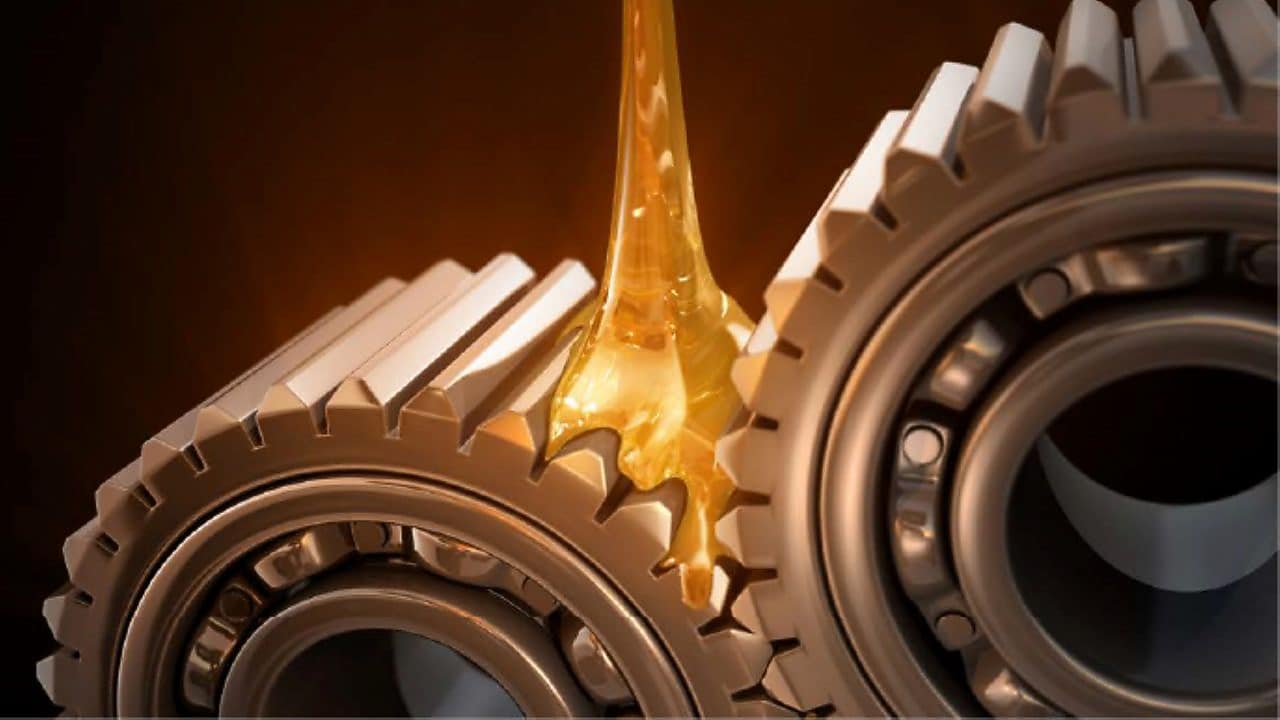 Gears turning with oil being poured 