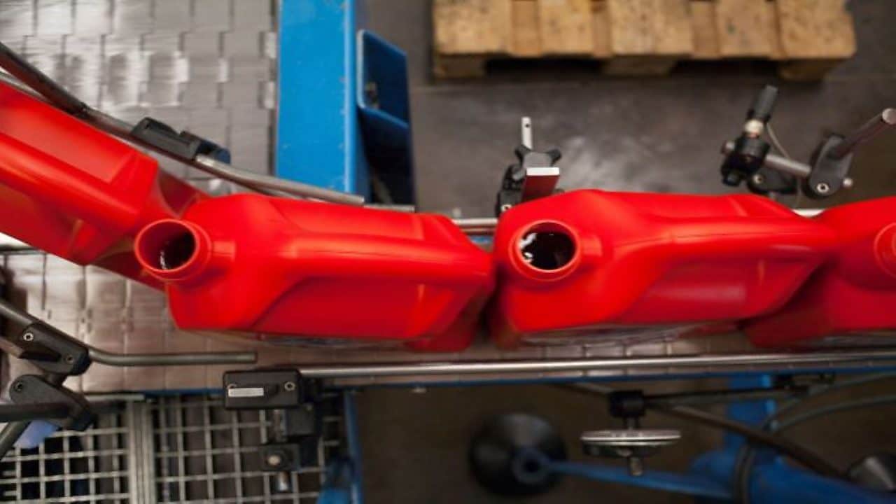 Oil bottles at a plant being filled
