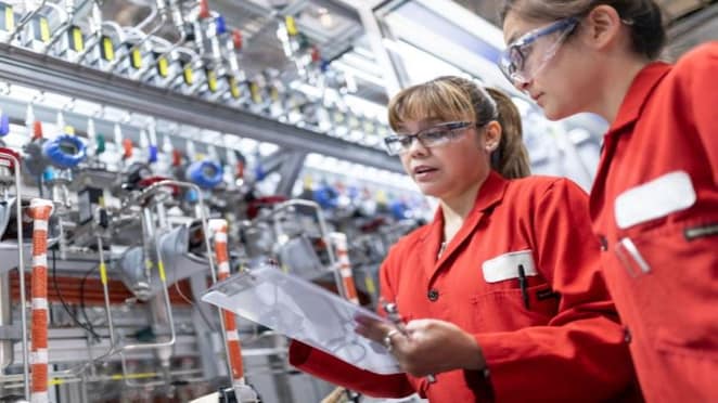 Two technician reviewing data from OEM instruments