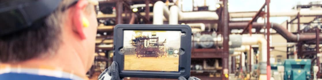 Technician assessing the site and capturing images on a tablet.