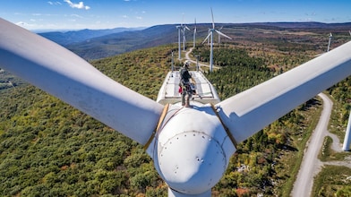 A maintenance crew member working at height at Mount Storm Wind Turbine.