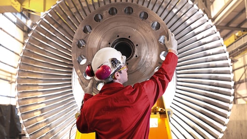man repairing turbines
