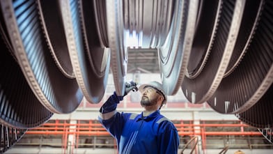 Engineers inspecting a turbine