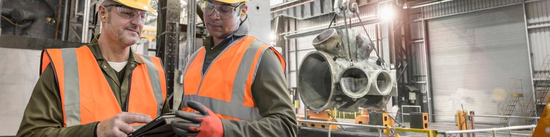 Industry workers analysing operations on site