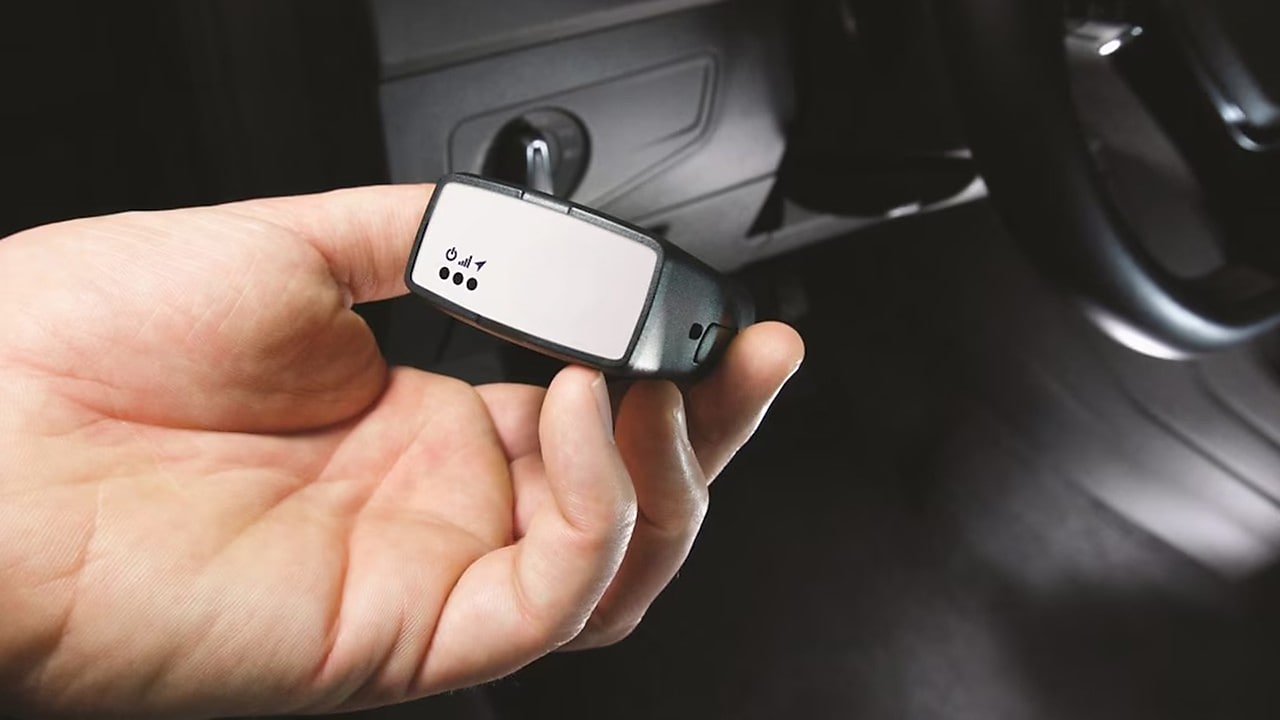 Someone holding Telematics hardware