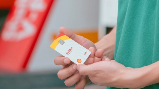 Driver near Shell gas station holding card