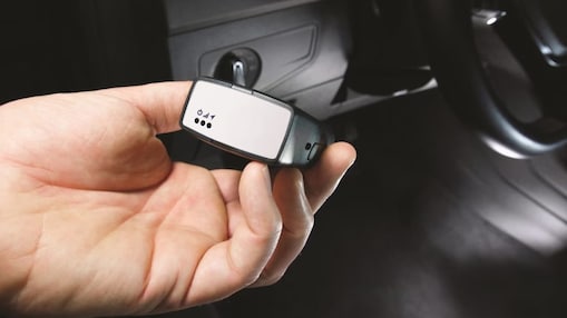 Someone holding Telematics hardware