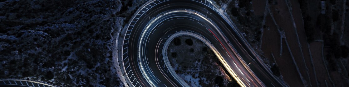 Aerial view of a winding road at night time