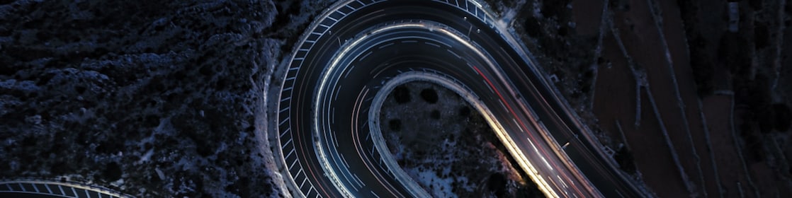 Aerial view of a winding road at night time
