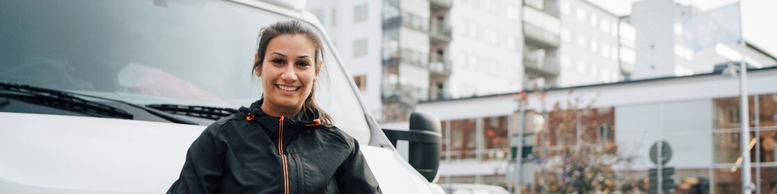 Image of lady leaning on a van