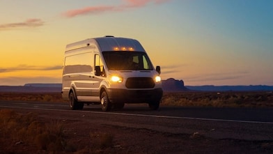 Fleet truck driving in sunset