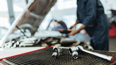 Ratchet spanner and sockets in car workshop