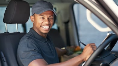 Man Smiling Inside Truck