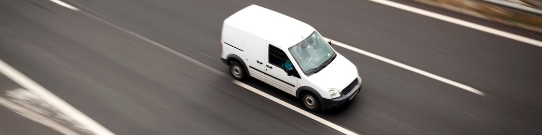 Delivery white van moving highway road