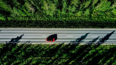 Aerial view of road and car